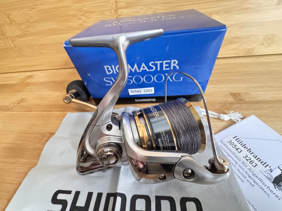 Stationärrolle, Shimano, Biomaster SW 5000XG, mit geflochtener Schnur, Rollenbeutel, im Karton, leichte Gebrauchsspuren